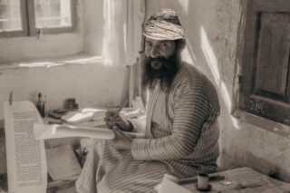 Art of Scribe copying the Torah, Casual English Bible.