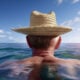 AI image of man in straw hat in the ocean